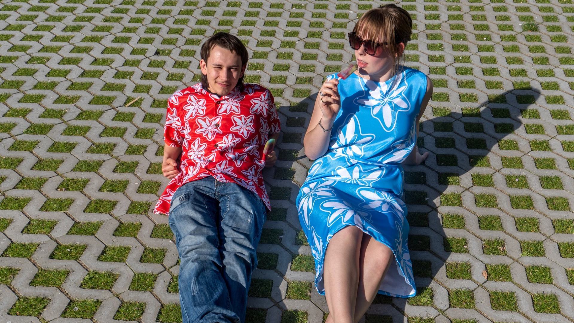 Red Inhibiscus Hawaii shirt, blue dress