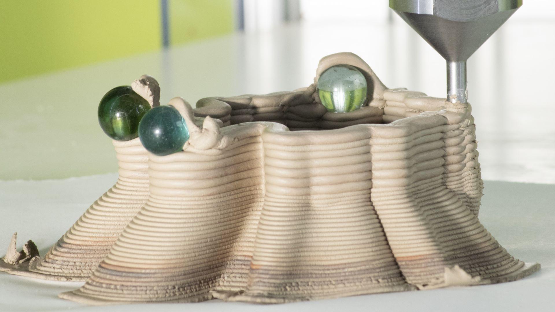 Printing over hand-positioned marbles.