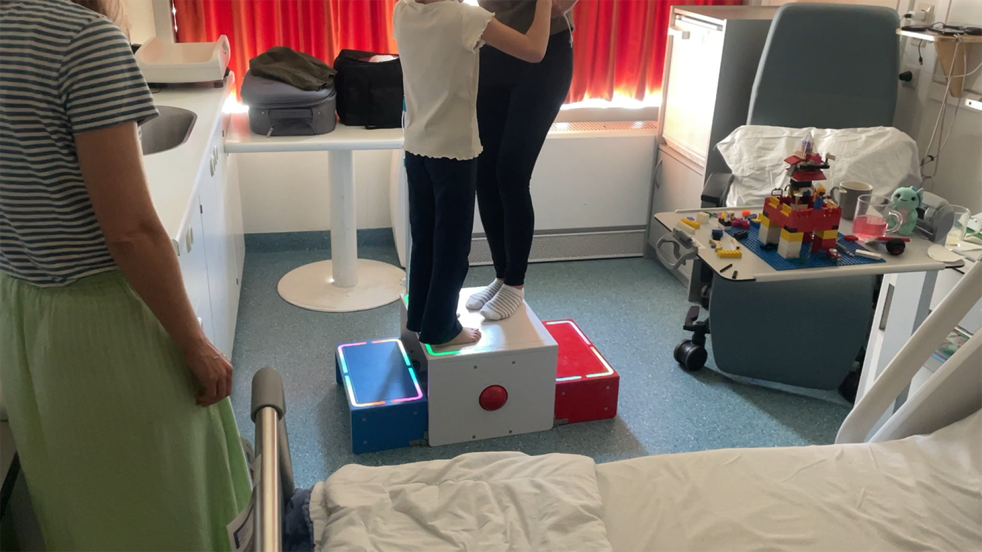 Daughter and mother dancing on the middle platform