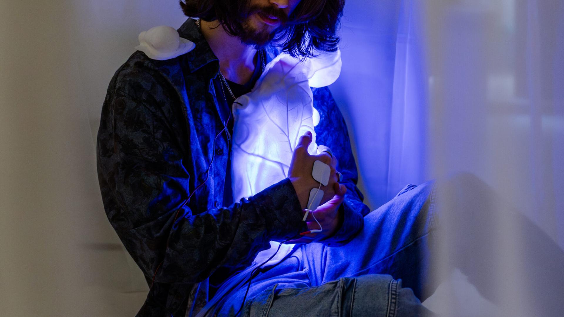 Visitor holding one of the sculptures
