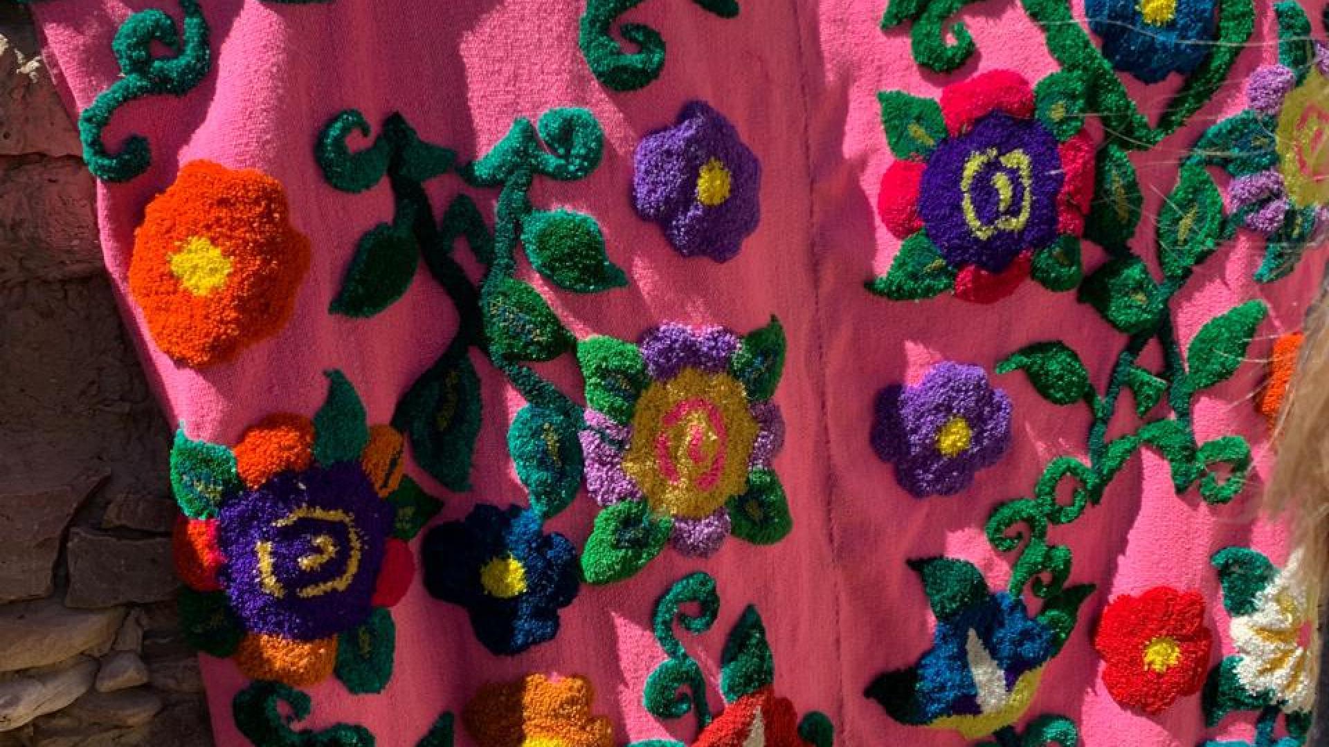 Hand-embroidered blanket by Andean artisans