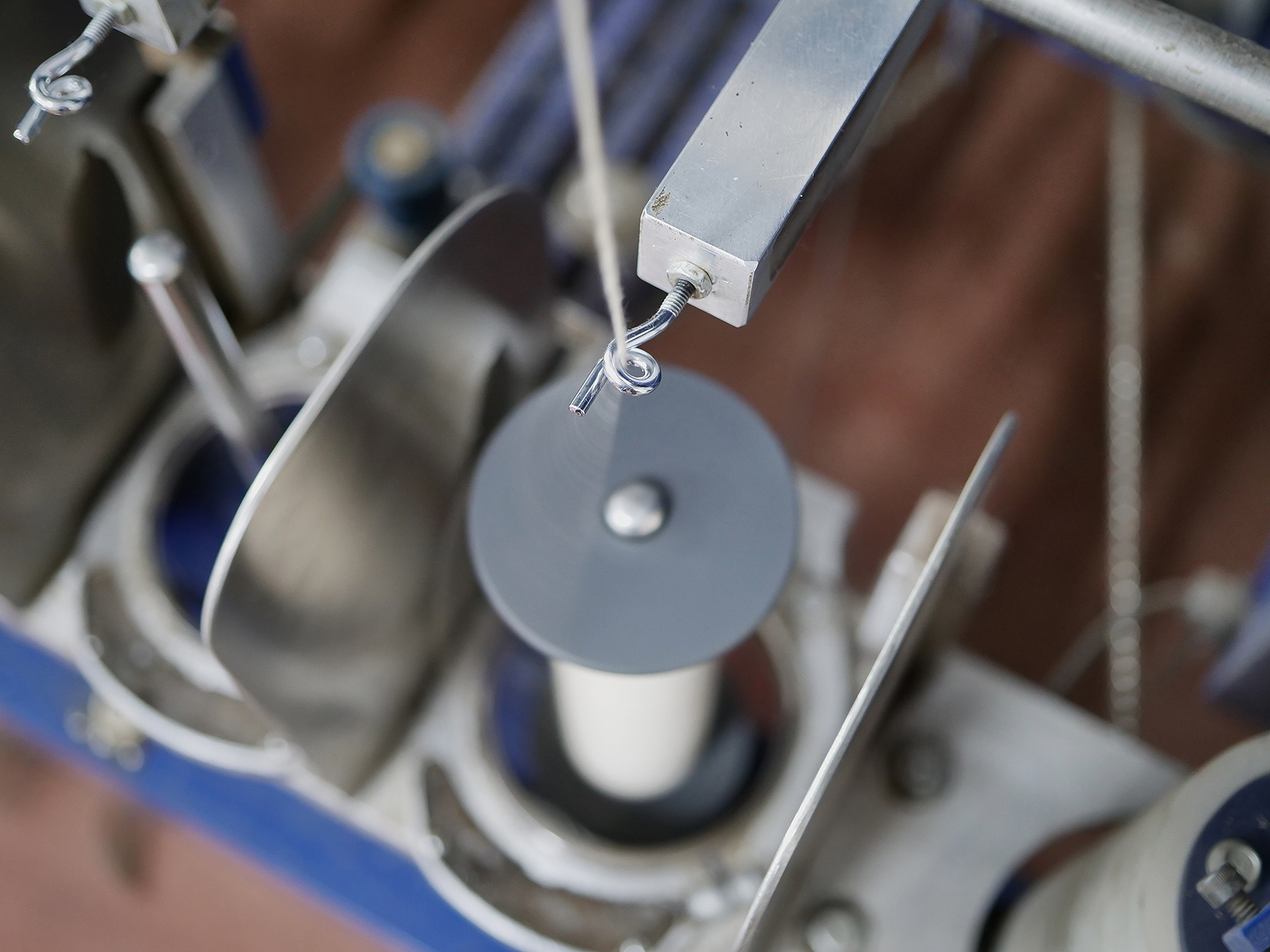 Spinning raw fiber to yarn.