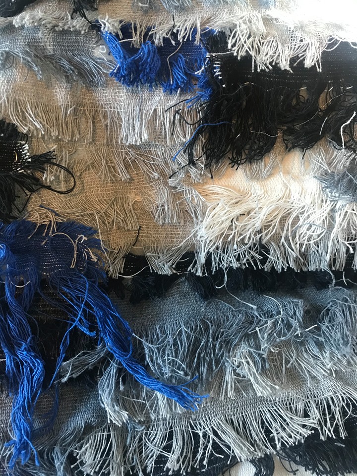 Fabric created from frayed edges