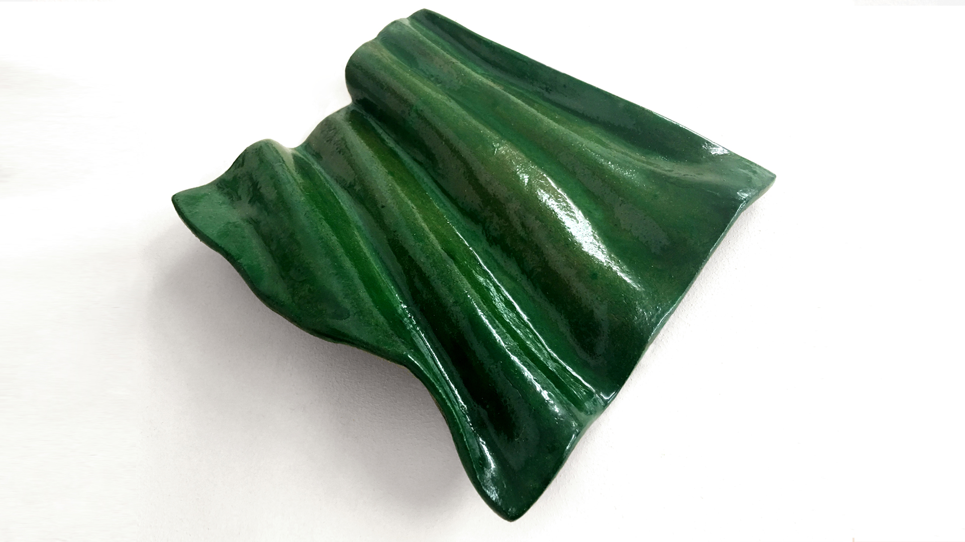Biophilica material shaped into a wavy tile