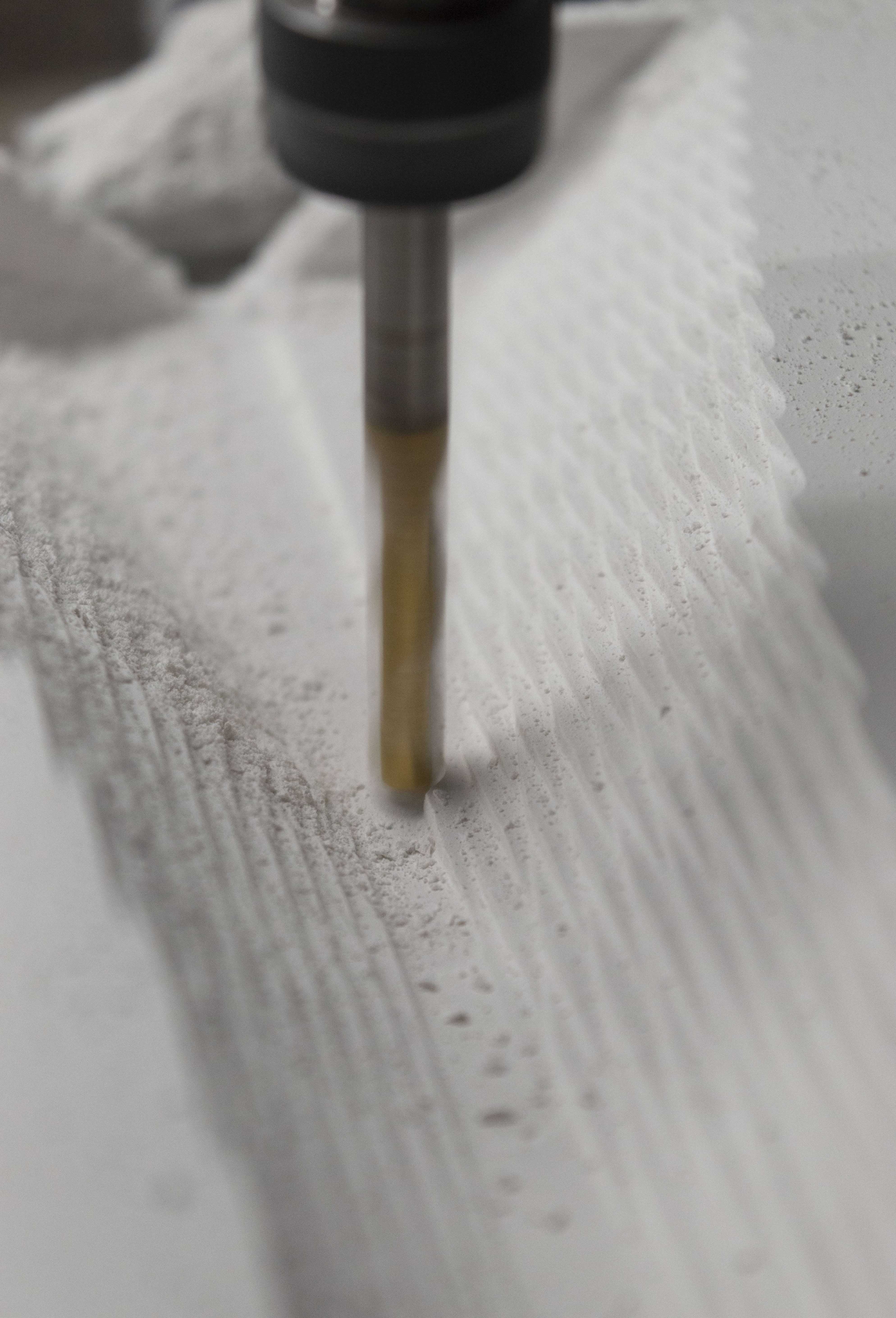 CNC router bit milling out the plaster mold
