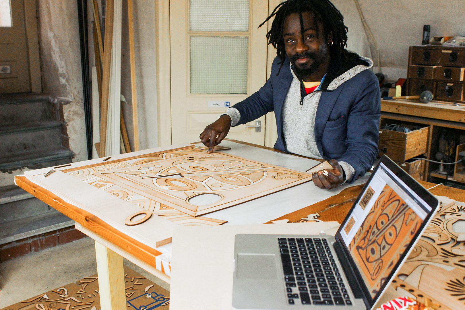 Sapin Makengele working on his design.