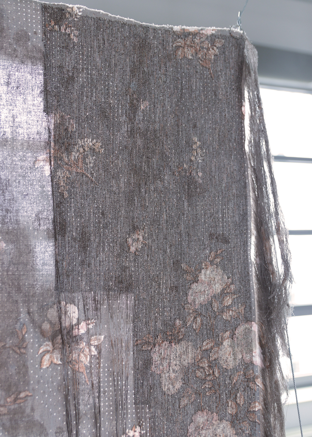 A discarded textile transformed through undoing