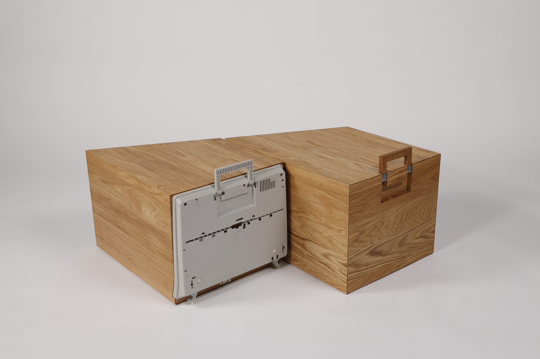 Base of an electric typewriter with oak