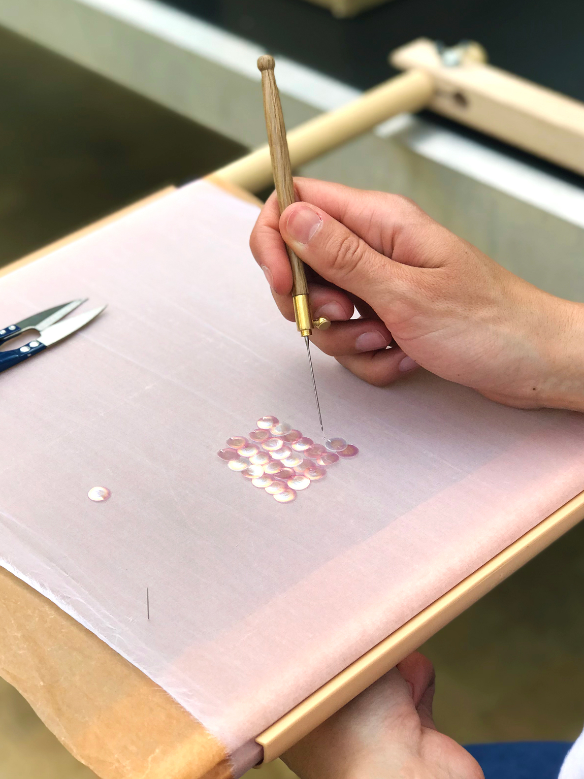 Embroidering a sample with couture techniques