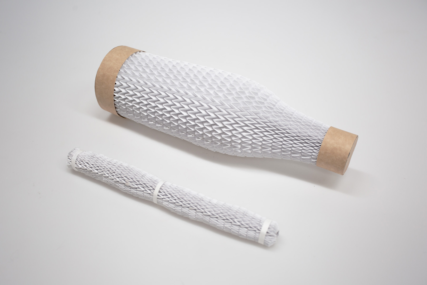 Folded pattern wraps firmly around objects