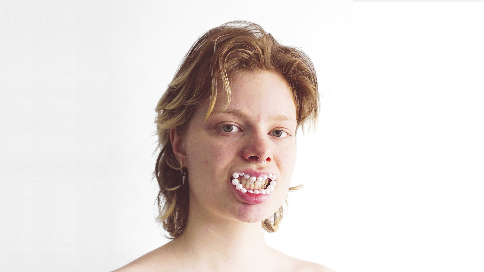 "Make your smile pop with minimal, chic jewelry"