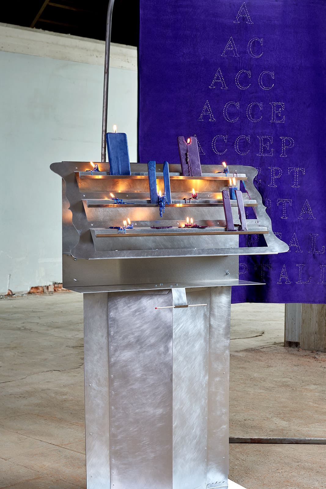 Smartphone and charger candles on a votive altar
