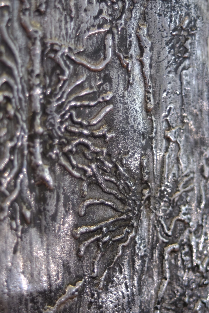 Wall sculpture of bark beetle trace