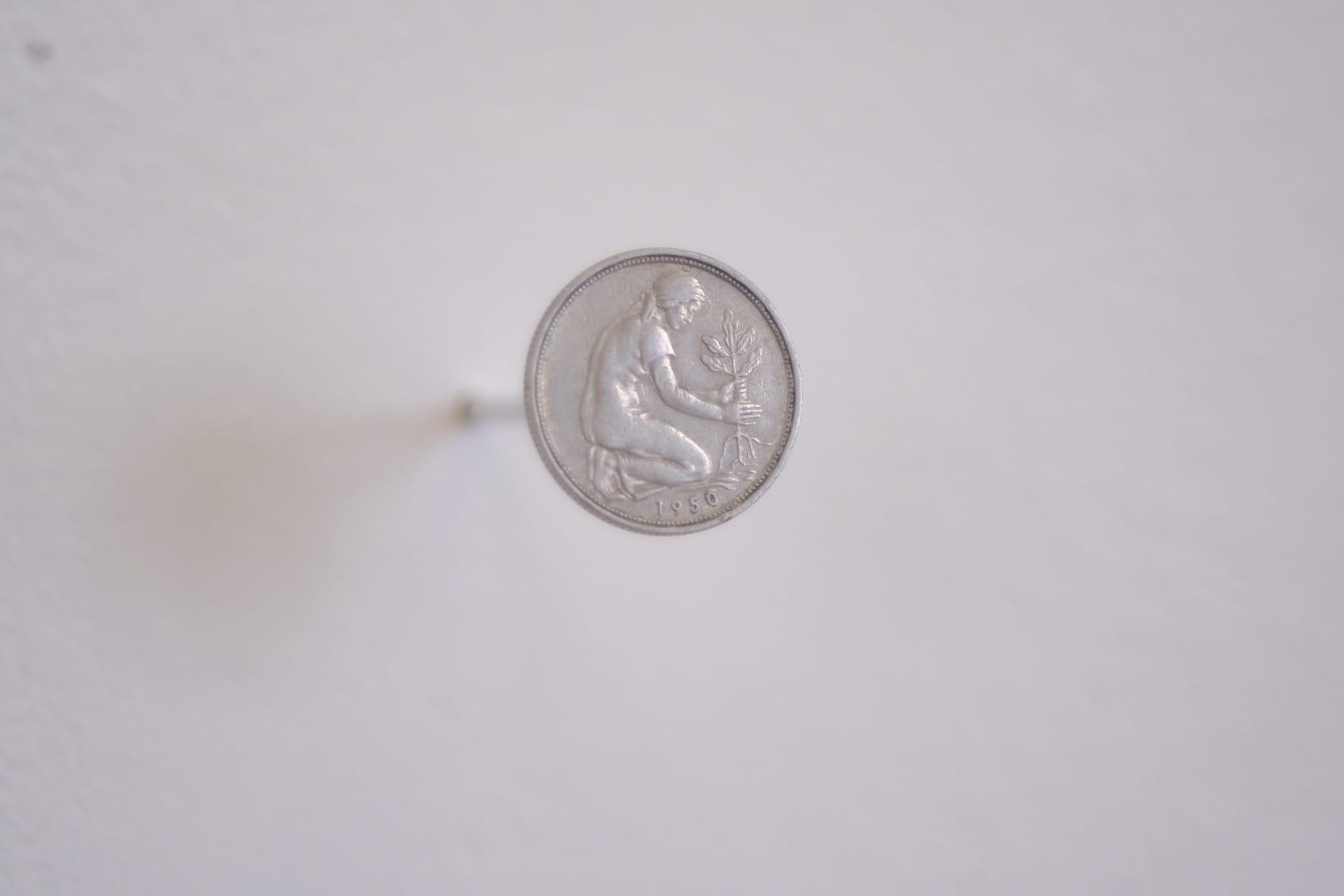 50 Pfennig coin minted with German culture women