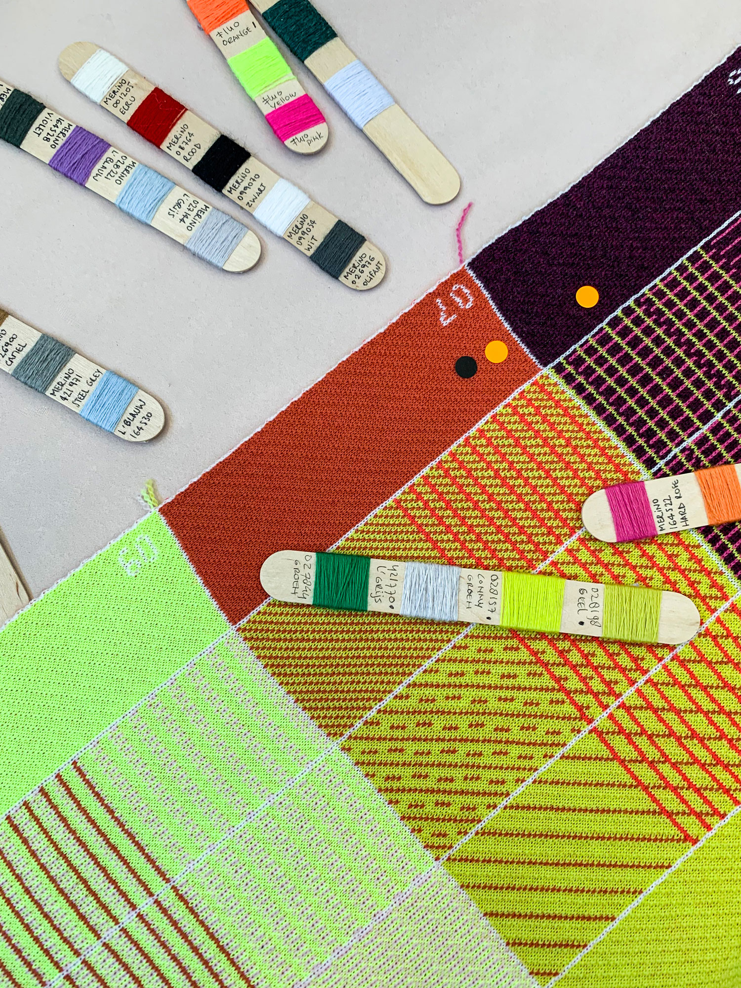 Yarn wraps and knitted colour samples