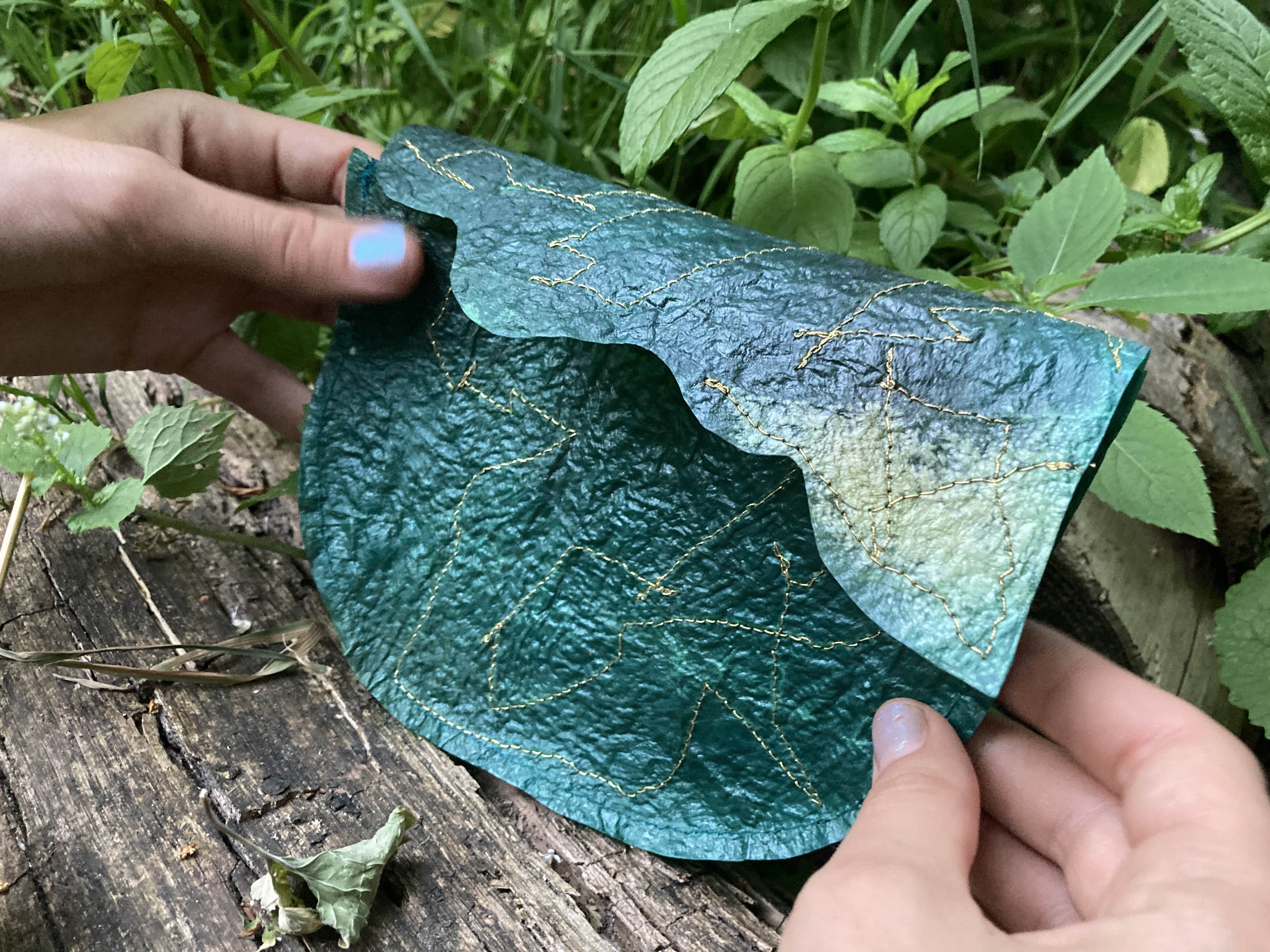 A sea-green handbag reminiscent of the ocean