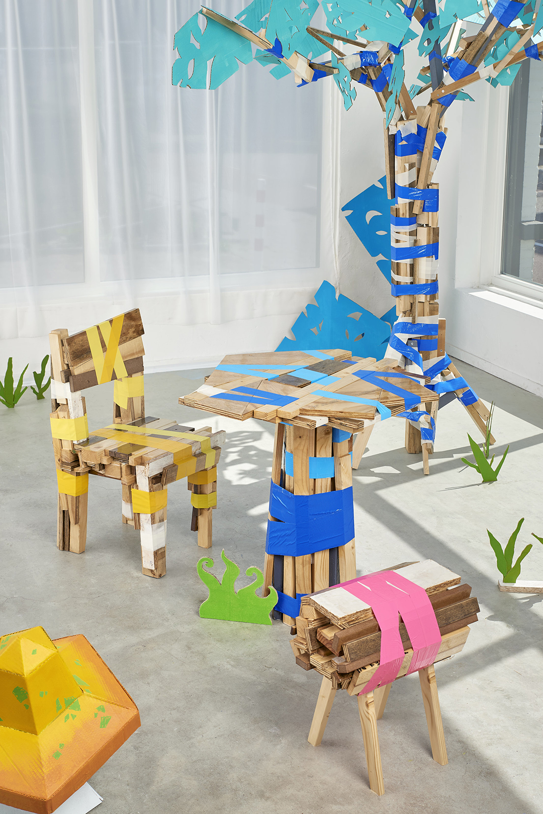 Lumber Table and Chair next to a Tree-construct