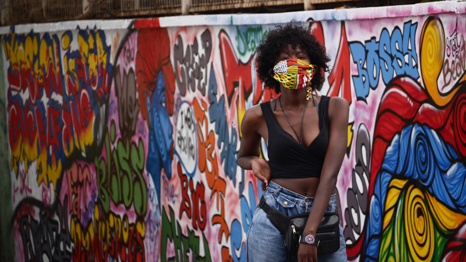 Dancer Antonate in front of #LabelledHuman mural
