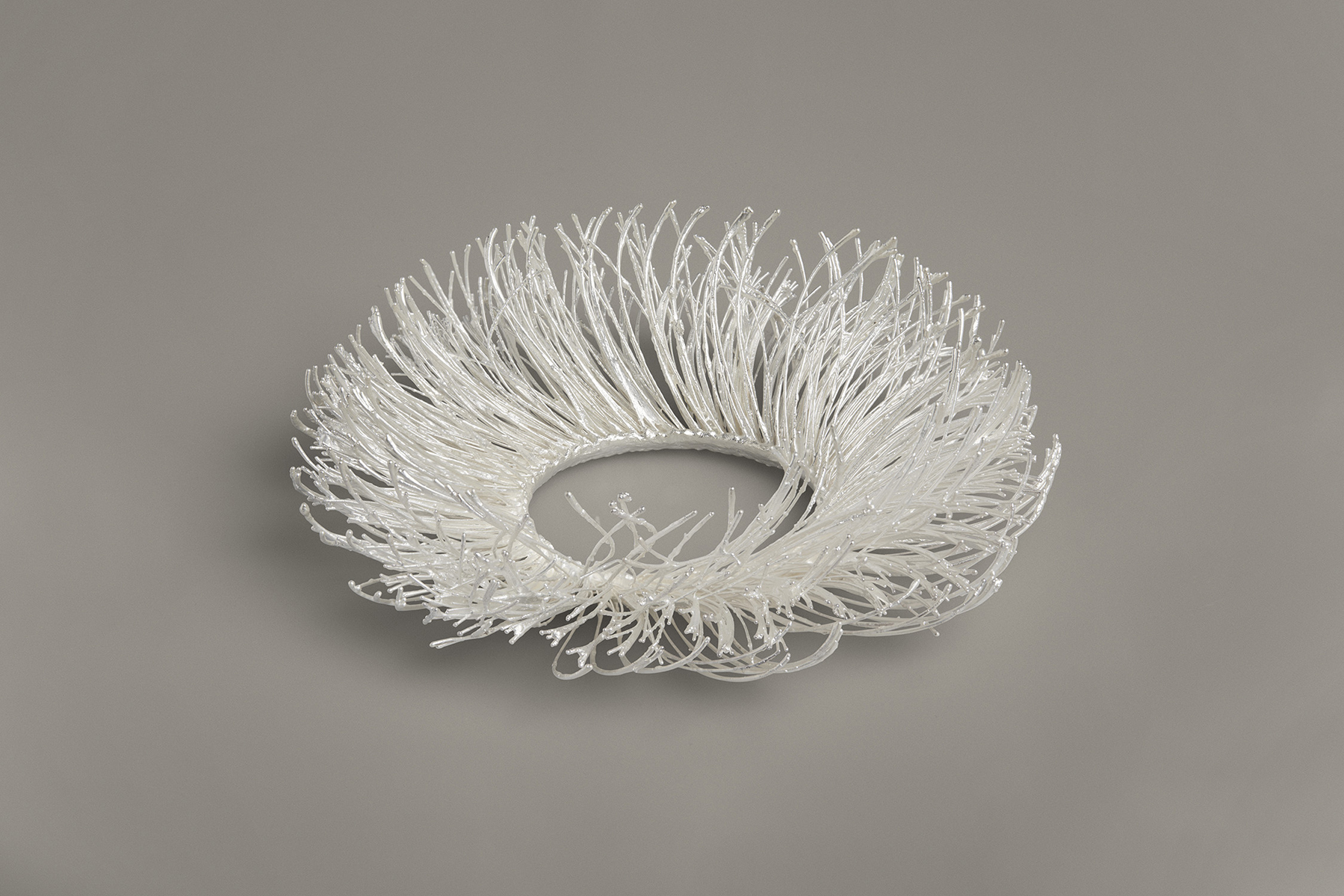 A bracelet made of silver-plated technical textile