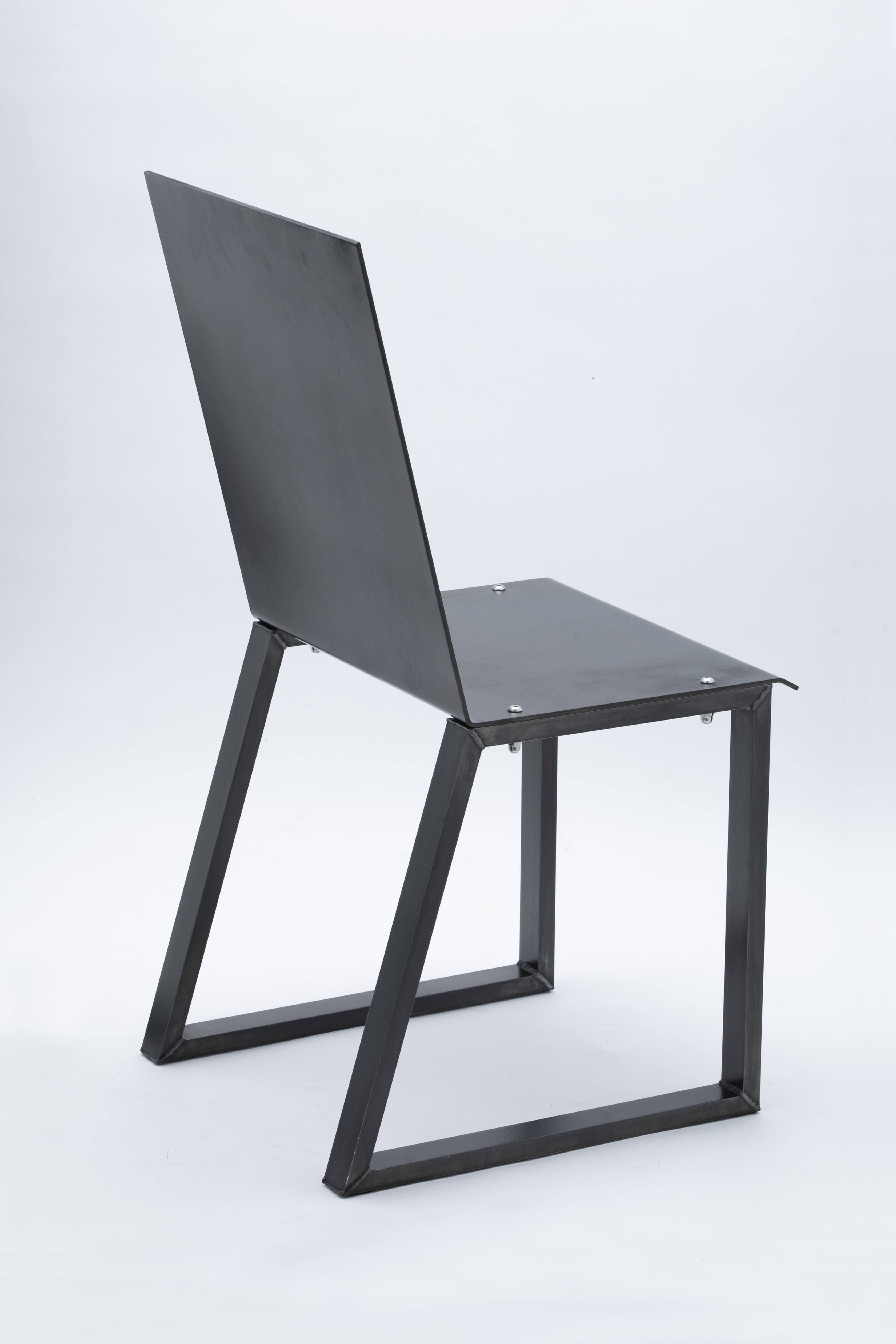CH01 chair, blackened version - back view