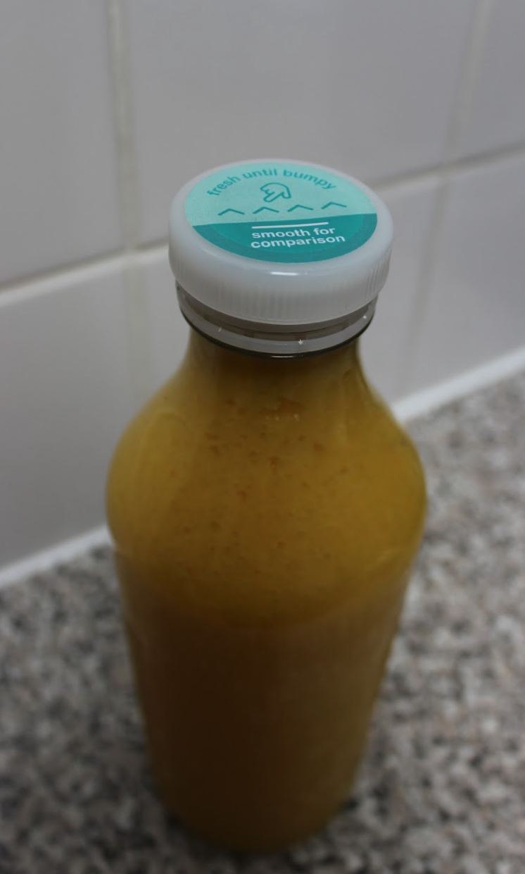 Mimica Touch cap on a juice bottle.