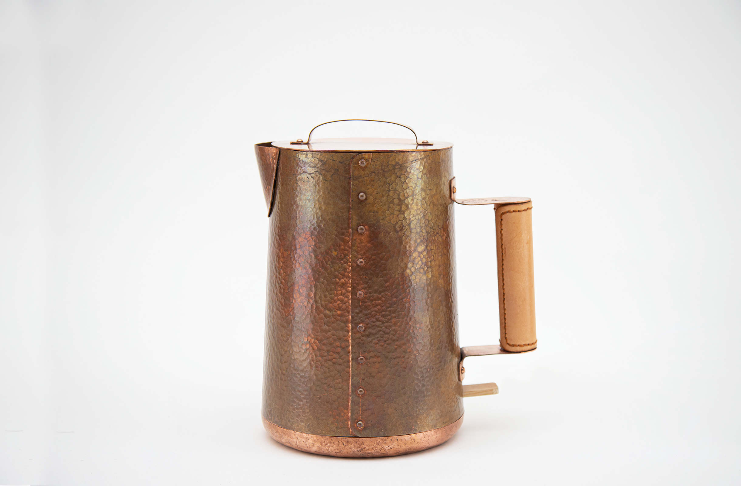 An electric kettle made with hammered copper.