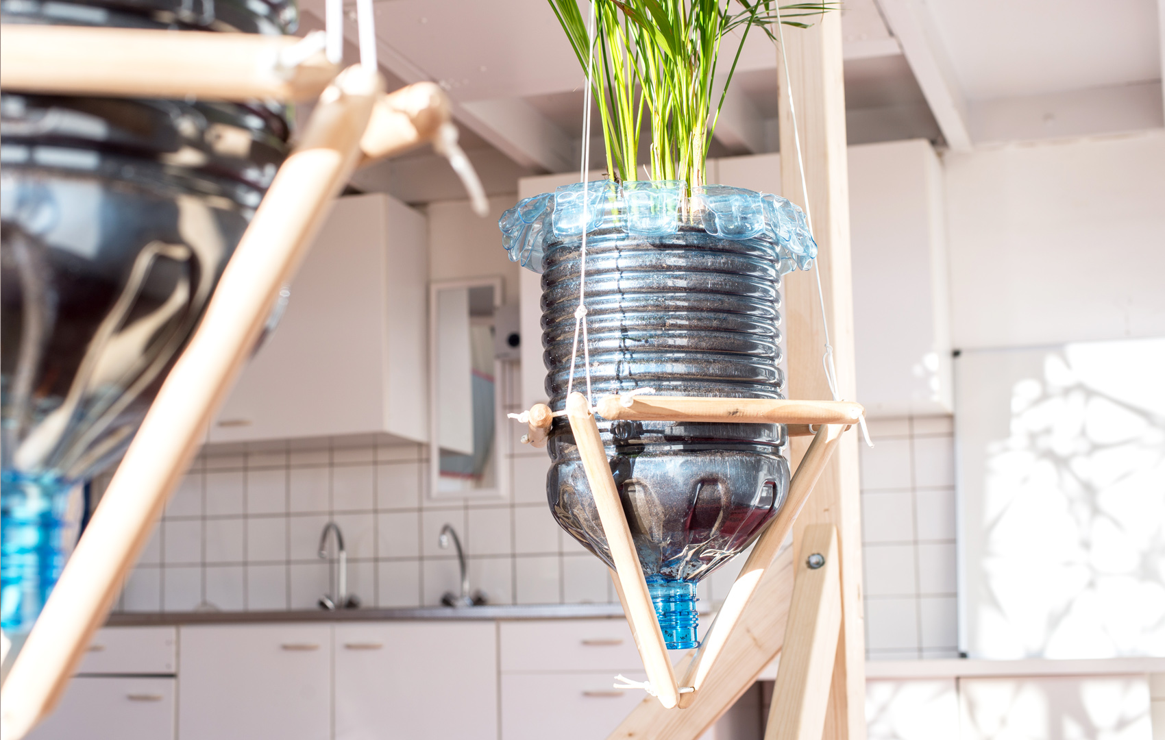 Floating plant pots made from water cooler bottles