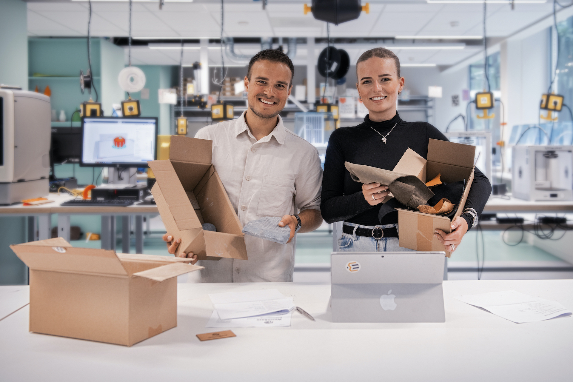The WasteBase team holding new material samples